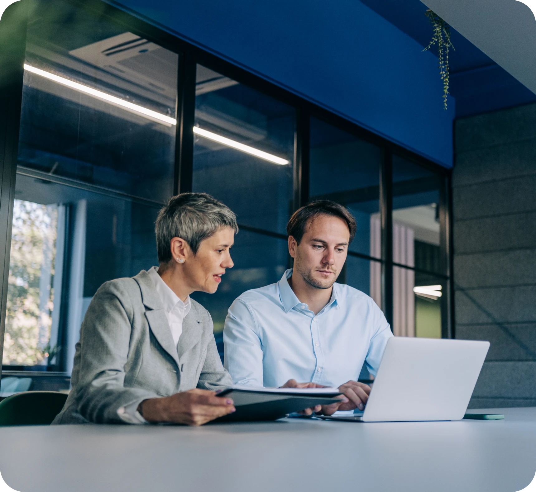 Two colleagues working at a desk