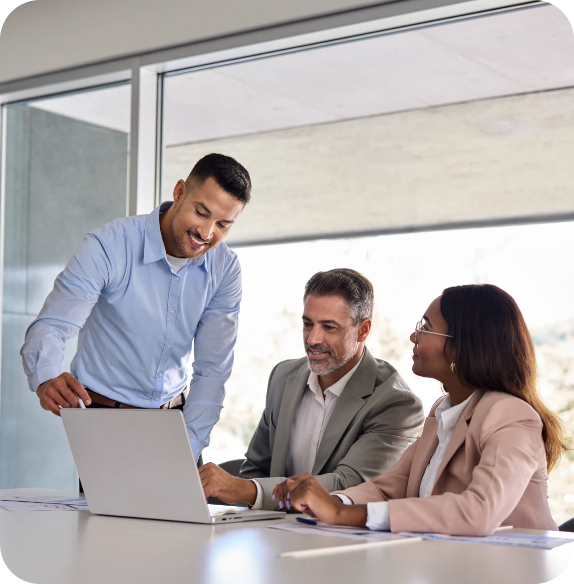 Colleagues discussing work at a table